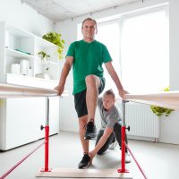 Senior man exercising at rehab